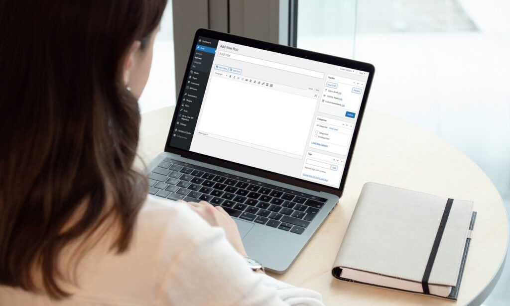 Woman looking at a WordPress blog post on a laptop